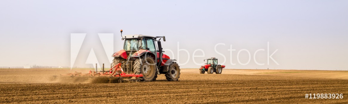 Picture of Farmer in tractor preparing land with seedbed cultivator